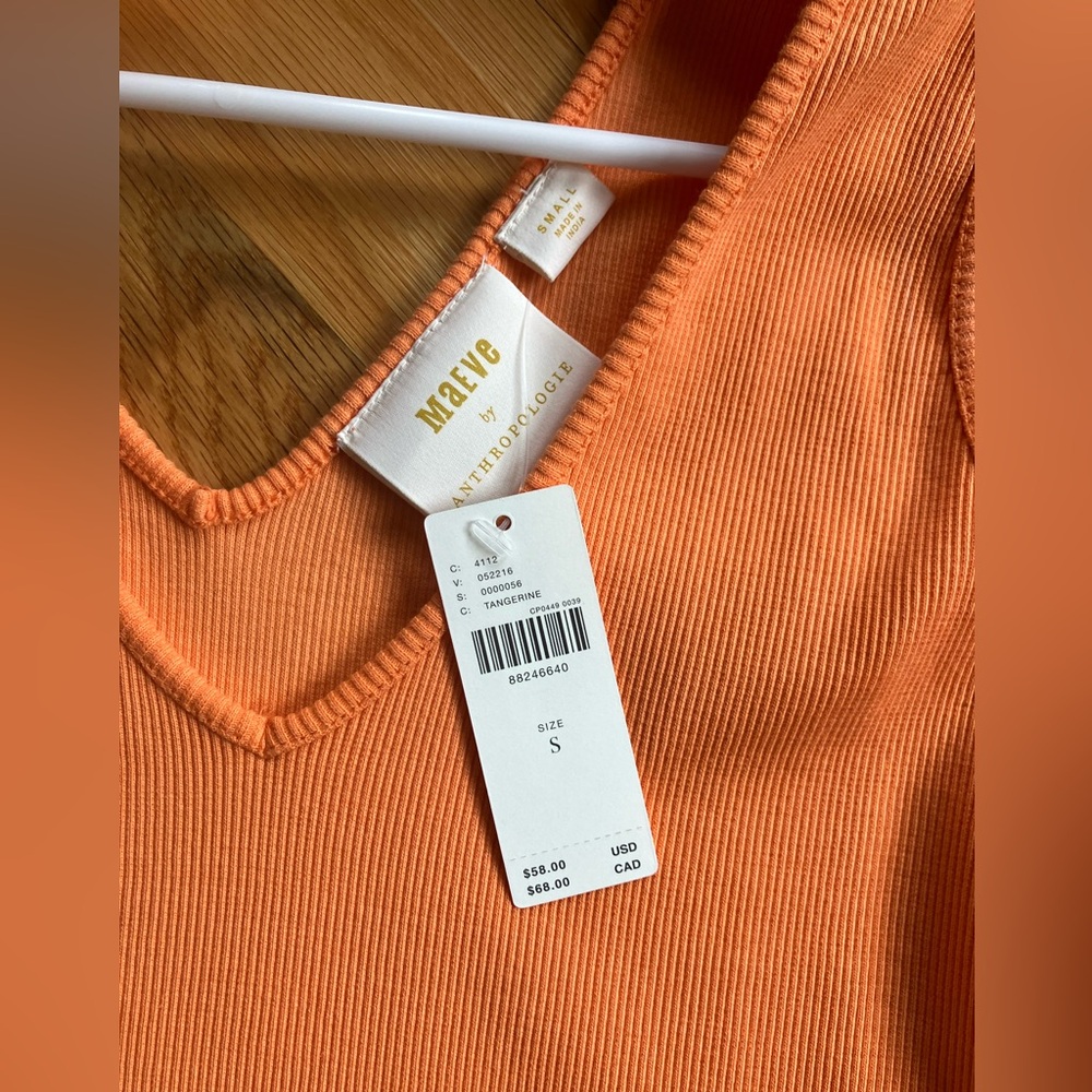 Adorable orange top.  New with tags and top bow or just knot